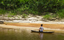 Canoeing along a beach during the dry season